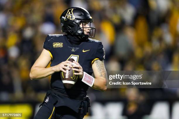 Joey Aguilar of the Appalachian State Mountaineers looks to throw the ball during a football game against the Coastal Carolina Chanticleers at Kidd...
