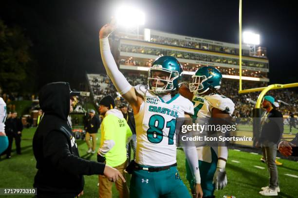 Payton Bunch of the Coastal Carolina Chanticleers waves to Appalachian State Mountaineers fans after a football game at Kidd Brewer Stadium in Boone,...