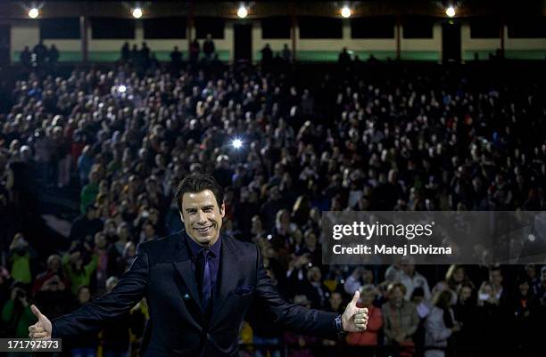 Actor John Travolta poses as he arrives for the outside screening of Grease film after the opening ceremony of the 48th Karlovy Vary International...