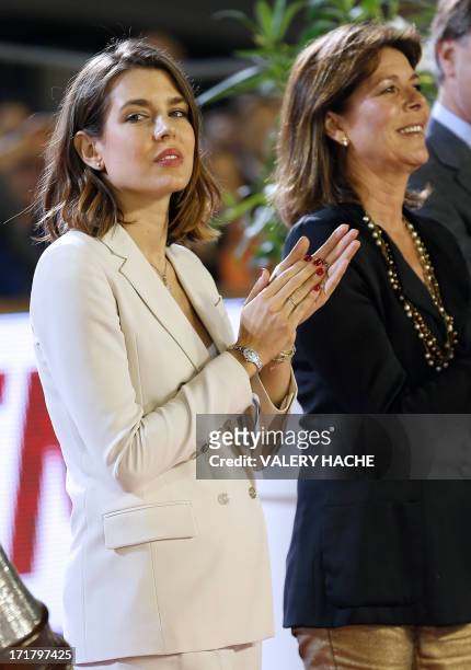 Charlotte Casiraghi and her mother Princess Caroline of Hanover applaud during the podium ceremony at the 2013 Monaco International Jumping as part...