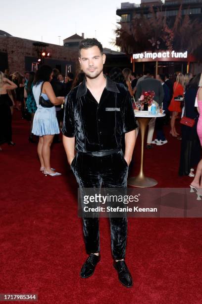 Taylor Lautner attends as Selena Gomez hosts the Inaugural Rare Impact Fund Benefit Supporting Youth Mental Health on October 04, 2023 in Los...