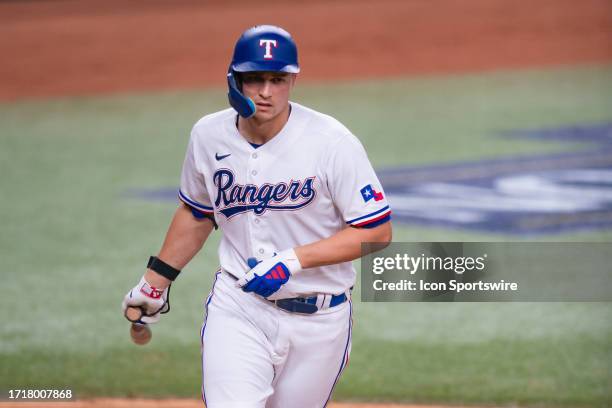 Texas Rangers shortstop Corey Seager gets walked during game 3 of the ALDS between the Baltimore Orioles and the Texas Rangers on October 10 at Globe...