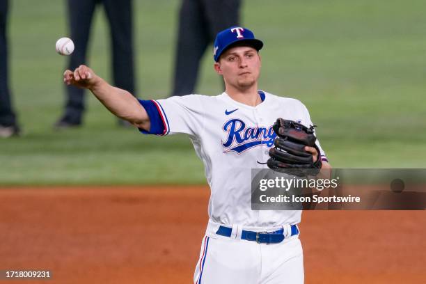 Texas Rangers shortstop Corey Seager throws to first between innings during game 3 of the ALDS between the Baltimore Orioles and the Texas Rangers on...