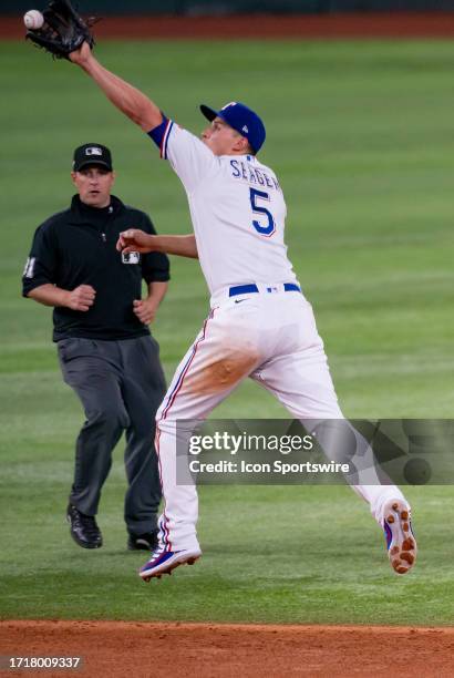 Texas Rangers shortstop Corey Seager makes a jumping catch during game 3 of the ALDS between the Baltimore Orioles and the Texas Rangers on October...