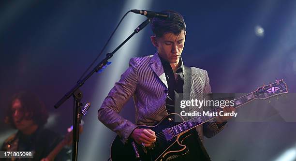 Arctic Monkeys lead singer Alex Turner performs on the Pyramid Stage at the Glastonbury Festival of Contemporary Performing Arts site at Worthy Farm,...