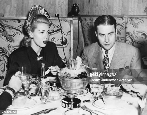 Actress Lana Turner and orchestra leader Artie Shaw having dinner at the Stork Club, New York, New York, November 14, 1941. They are together for the...