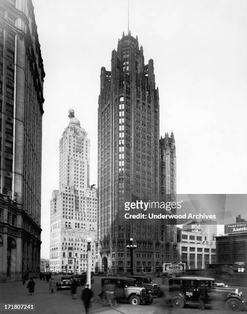 The Chicago Tribune Building with the Wrigley Building at left across Michigan Avenue, and the Hotel Intercontinental behind, Chicago, Illinois, 1929.