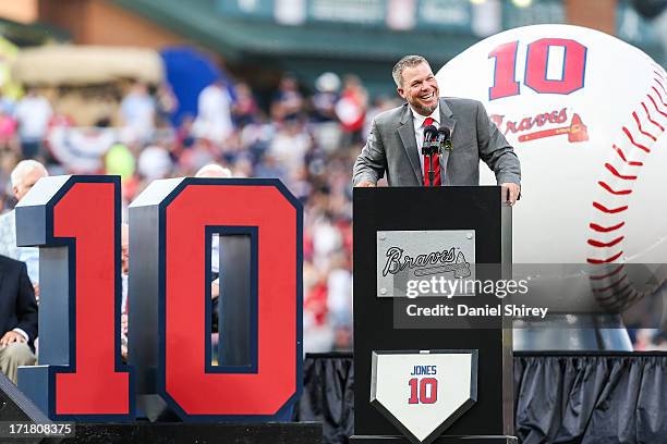 Chipper Jones of the Atlanta Braves speaks to fans during his number retirement ceremony before the game against the Arizona Diamondbacks at Turner...