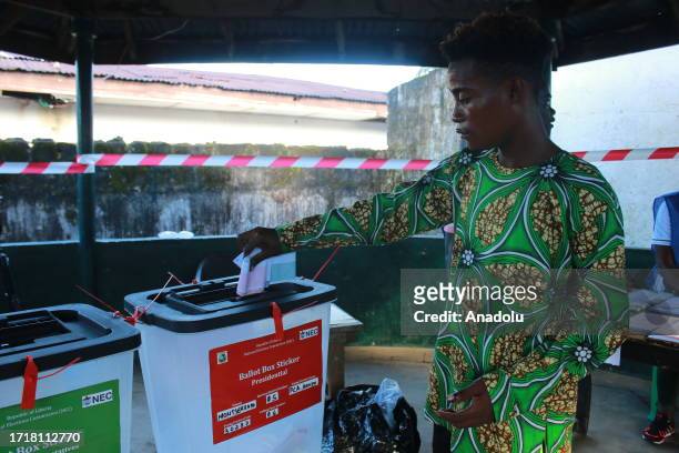 People vote at a polling station during the presidential and parliamentary elections in Monrovia, the capital of Liberia on October 10, 2023.