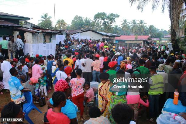 People wait to vote at a polling station during the presidential and parliamentary elections in Monrovia, the capital of Liberia on October 10, 2023.