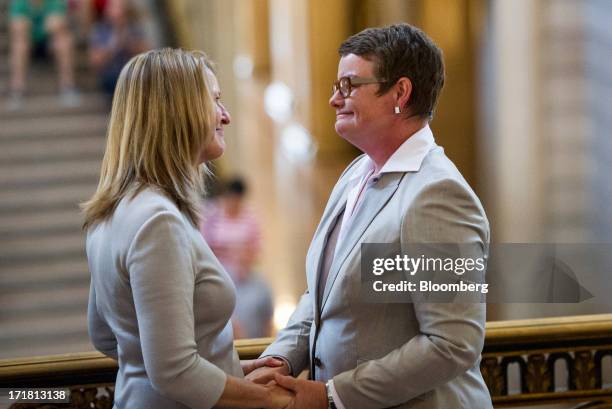 Sandy Stier, left, and Kris Perry look at each other after being married in City Hall in San Francisco, California, U.S., on Friday, June 28, 2013....