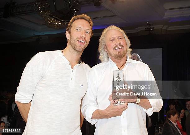 Chris Martin and Barry Gibb during Bee Gees presentation of the Sony Mobile Lifetime Achievement Award at the Nordoff Robbins Silver Clef Awards at...