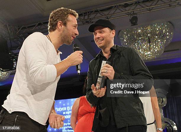 Chris Martin and Jonny Buckland of Coldplay during presentation of the Royal Albert Hall Best British Act Award at the Nordoff Robbins Silver Clef...