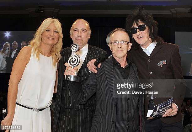 Gaby Rosalyn, Mick Jones, Nicky Headon and John Cooper Clarke during The Clash presentation of The 02 Silver Clef Award at the Nordoff Robbins Silver...