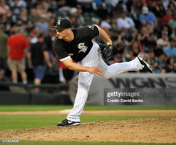 Casper Wells outfielder of the Chicago White Sox pitches against the Cleveland Indians during the ninth inning in the first game of a doubleheader on...