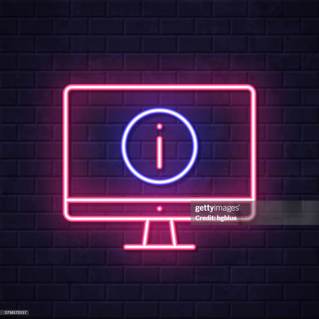 Desktop computer with information sign. Glowing neon icon on brick wall background