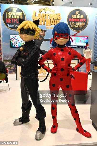 Ladybug and Cat Noir characters pose at the DeAPlaneta Entertainment stand during the Brand Licensing Europe at ExCel on October 04, 2023 in London,...