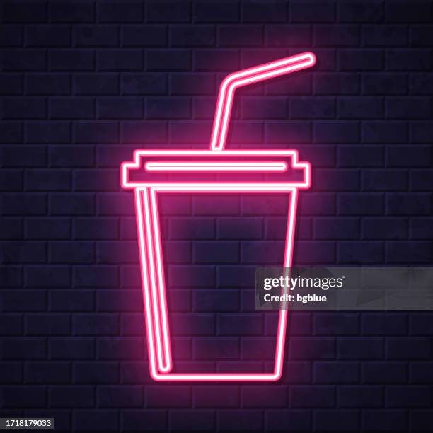 cup with straw. glowing neon icon on brick wall background - coffee take away cup simple stock illustrations