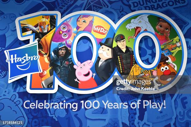 Sign celebrating one hundred years of play is displayed at the Hasbro stand during the Brand Licensing Europe at ExCel on October 04, 2023 in London,...