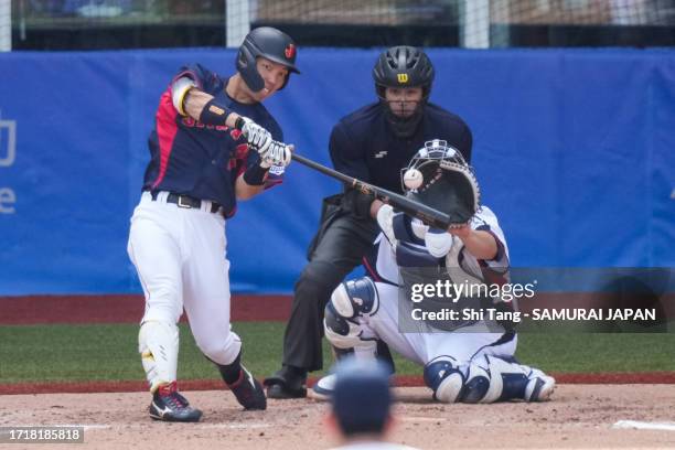 Masashi Maruyama of Team Japan bats in the 4th inning during the baseball Super Round game Japan and South Korea on day ten of the 19th Asian Games...