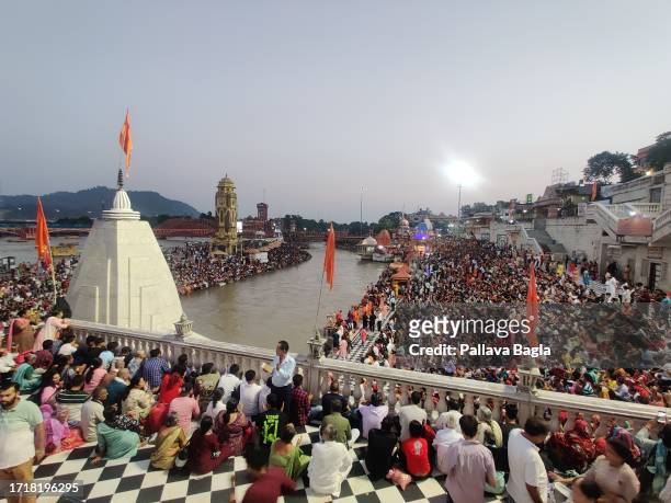 Millions of religious Hindu devotees throng the banks of the holy River Ganga for a dip and bathing on auspicious full moon day seen here on October...