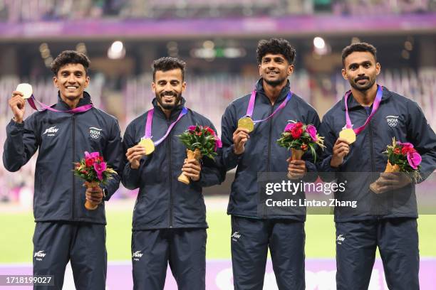 Gold medalist Team India celebrates during the victory ceremony for the men's 4x400-meter relay athletics event during the 2022 Asian Games at...