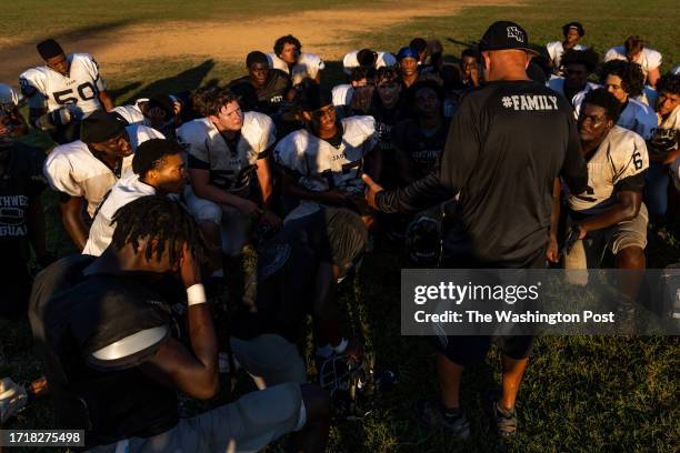 Northwest High School football head coach Bucky Clipper speaks with players at the end of practice on Wednesday, October 4, 2023.