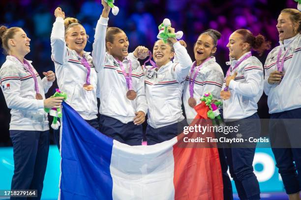 October 04: The French team on the podium with their bronze medals after the Women's Team Final, gymnasts include, Morgane Osyssek-Reimer, Lorette...