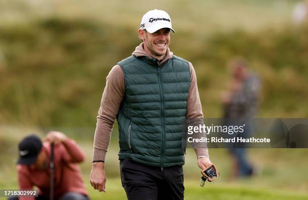 Former Footballer Gareth Bale looks on on the 3rd green during Day One of the Alfred Dunhill Links Championship at Carnoustie Golf Links on October...