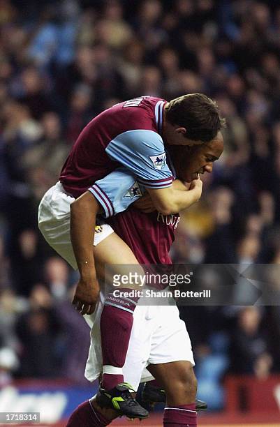 Dion Dublin of Aston Villa celebrates scoring with his team mate during the FA Barclaycard Premiership match between Aston Villa and Middlesbrough...