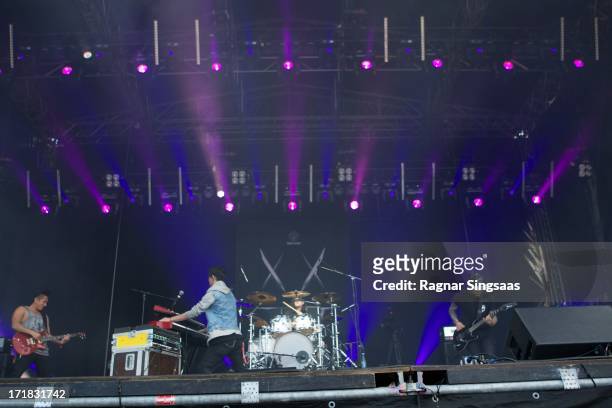 Nick Tsang, Josh Friend, Matthew Curtis and Tony Friend of Modestep perform on stage on Day 3 of Rock The Beach Festival on June 28, 2013 in...