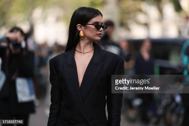 Sara Sampaio is seen outside Zimmermann show wearing black sunnies, golden earrings, golden necklace, black blazer dress during the Womenswear...