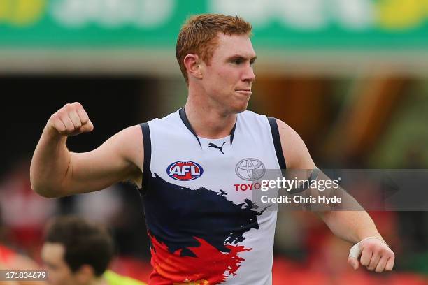 Tom Lynch of the Crows celebrates after kicking a goal during the round 14 AFL match between the Gold Coast Suns and the Adelaide Crows at Metricon...