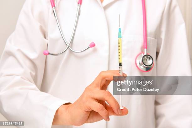 doctor and illness prevention - diphtheria stock pictures, royalty-free photos & images