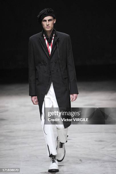 Model walks the runway during the Ann Demeulemeester Menswear Spring/Summer 2014 Show as part of the Paris Fashion Week on June 28, 2013 in Paris,...