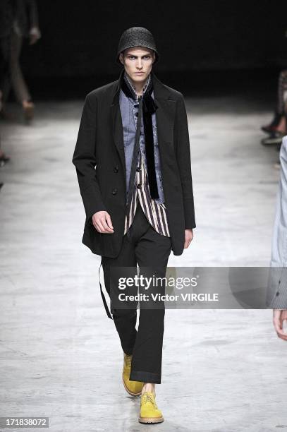 Model walks the runway during the Ann Demeulemeester Menswear Spring/Summer 2014 Show as part of the Paris Fashion Week on June 28, 2013 in Paris,...