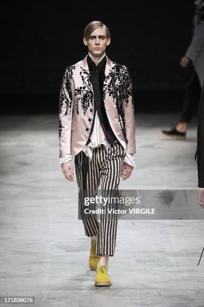 Model walks the runway during the Ann Demeulemeester Menswear Spring/Summer 2014 Show as part of the Paris Fashion Week on June 28, 2013 in Paris,...