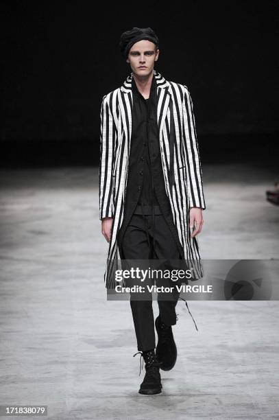 Model walks the runway during the Ann Demeulemeester Menswear Spring/Summer 2014 Show as part of the Paris Fashion Week on June 28, 2013 in Paris,...