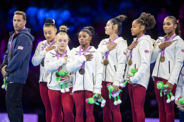 October 04: The United States team of coach Laurent Landi, Joscelyn Roberson, Kayla DiCello, Skye Blakely, Shilese Jones, Leanne Wong and Simone...