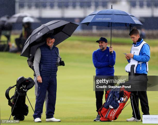 Martin Slumbers, Chief Executive of the R&A and LIV Golf Chairman, Yasir Al-Rumayyan interact on the first green during Day One of the Alfred Dunhill...