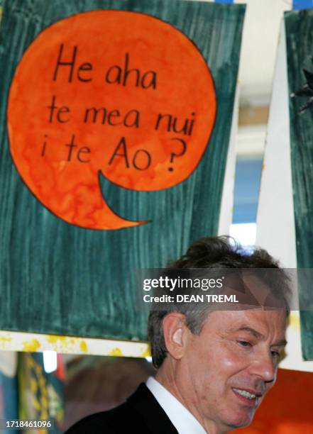 British Prime Minister Tony Blair stands undeneath a speech bubble which says in New Zealand maori "He aha te mea nui i te Ao" which means "What is...