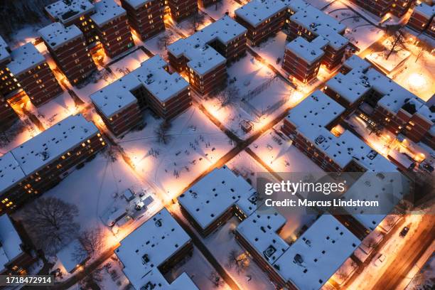 aerial view of a residential area on a winter evening - sweden snow stock pictures, royalty-free photos & images