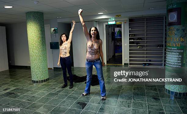 Egyptian activist Aliaa Elmahdy and another member of feminist group FEMEN stage a topless protest for women's rights and against the islamic...