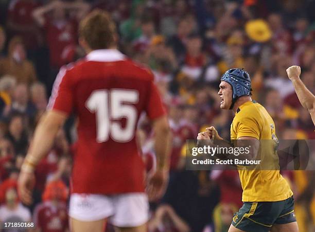 Leigh Halfpenny of the Lions looks on after attempting to kick a penalty in the final minute as James Horwill of the Wallabies celebrates victory...