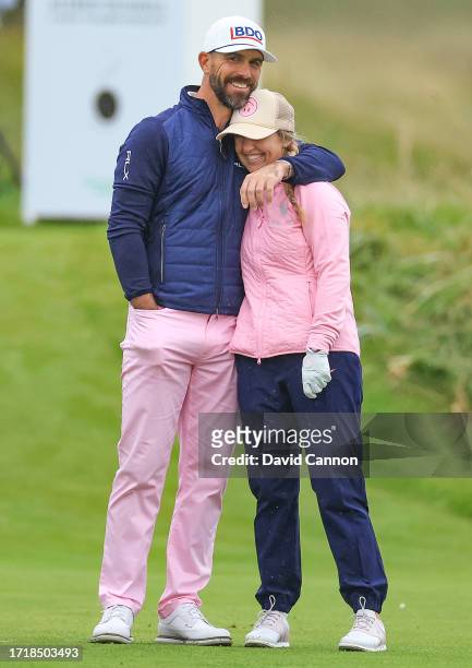 Billy Horschel of The United States enjoying a moment with his wife Brittany Horschel his playing partner on the third hole during the first round of...