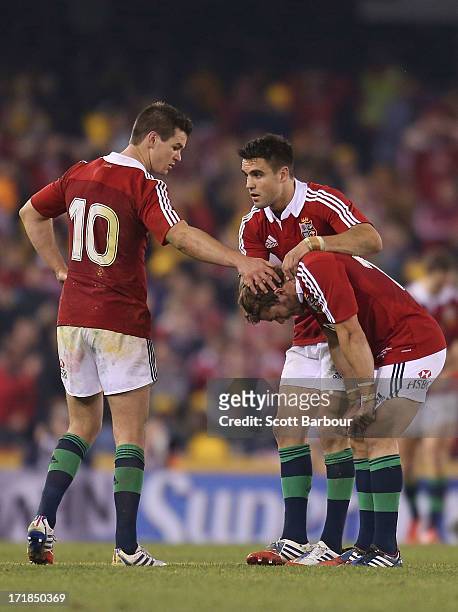 Leigh Halfpenny of the Lions is consoled by his teammates after missing a penalty kick in the final minute of the match during game two of the...