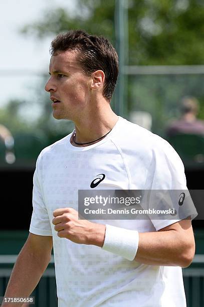 Kenny de Schepper of France celebrates a point during the Gentlemen's Singles third round match against Juan Monaco of Argentina on day six of the...