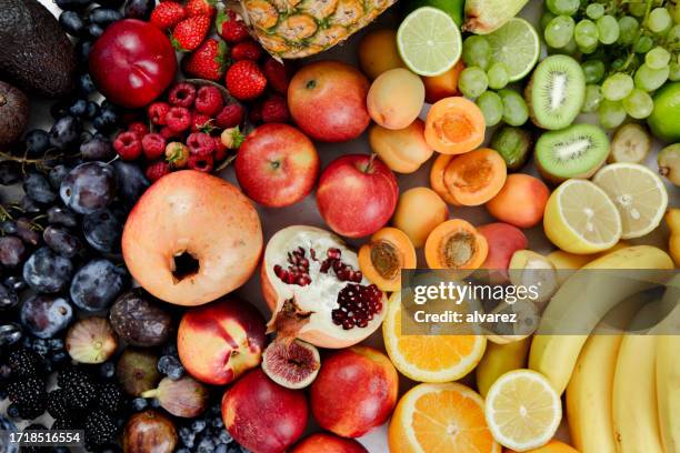 full frame of assortment of healthy and fresh fruits - orange apple lemon stock pictures, royalty-free photos & images