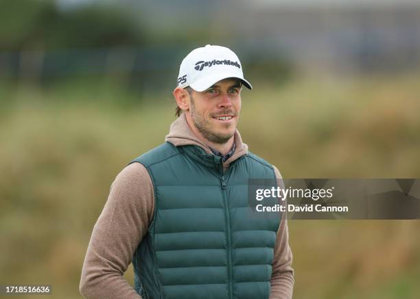 Gareth Bale of Wales the former international soccer player waits to play his tee shot on the second hole during the first round of the Alfred...
