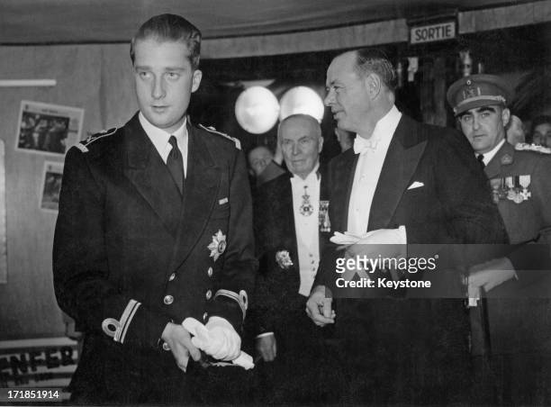 Prince Albert of Belgium, later King Albert II of Belgium is received by the U.S. Ambassador to Belgium whilst attending a Gala cinema show organised...